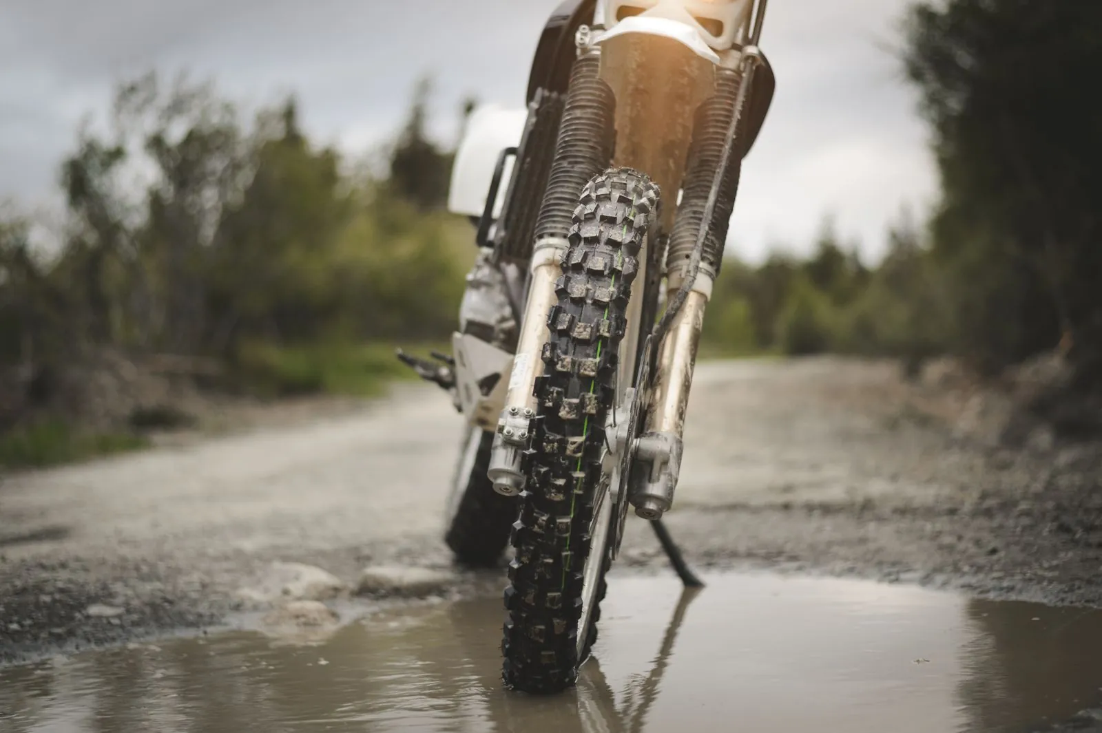 Dirt bike wheel on muddy road
