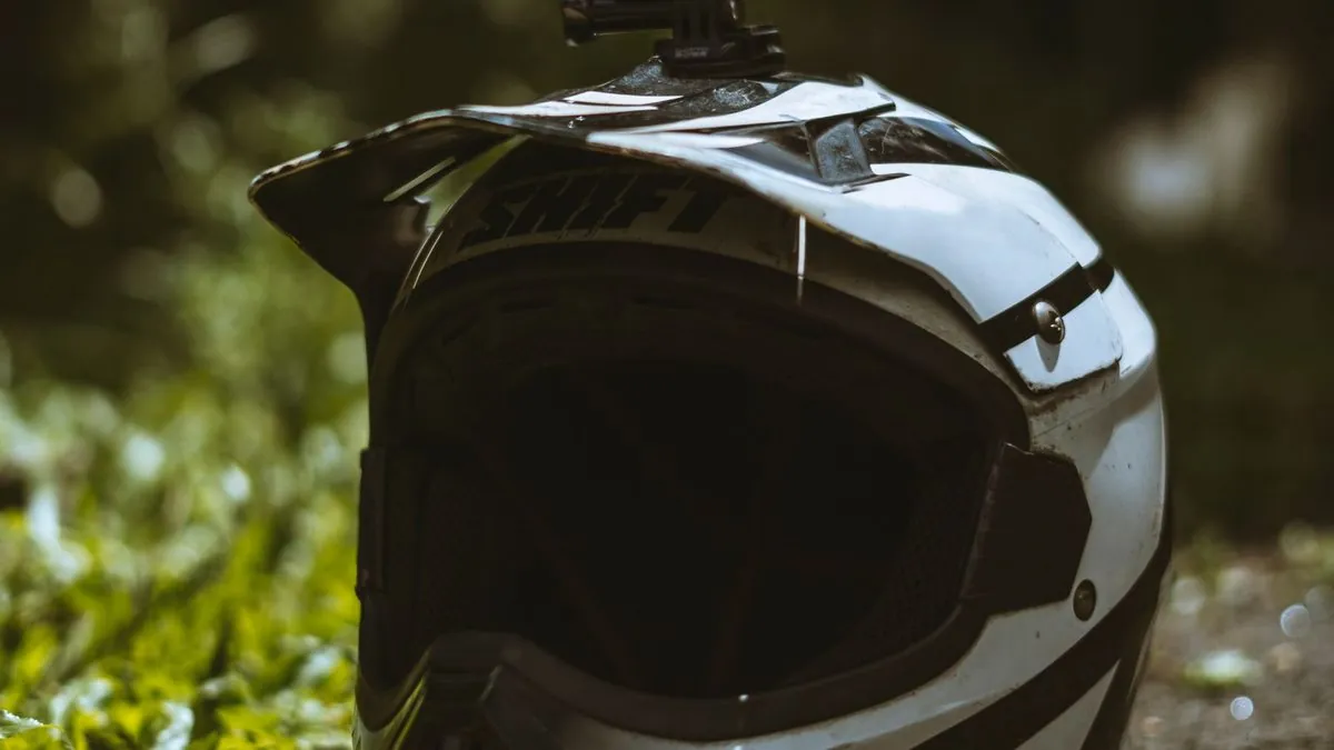 Motorcyclist with action camera on helmet
