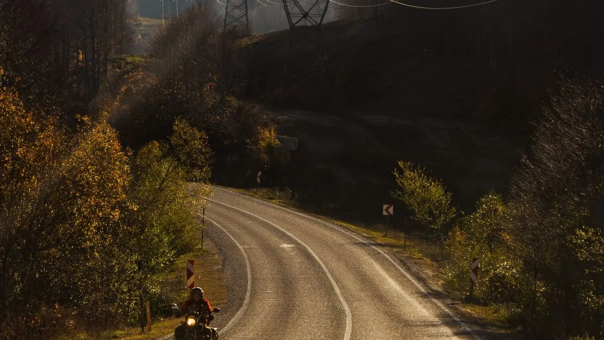 Scenic backroad through Atlantic Canada showing motorcycle touring on winding rural roads