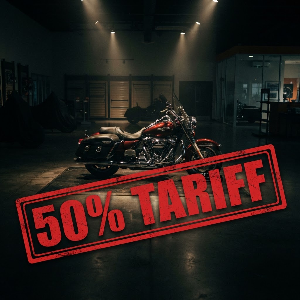 Motorcycle dealership showroom with touring cruiser under dramatic lighting and 50 percent tariff stamp overlay