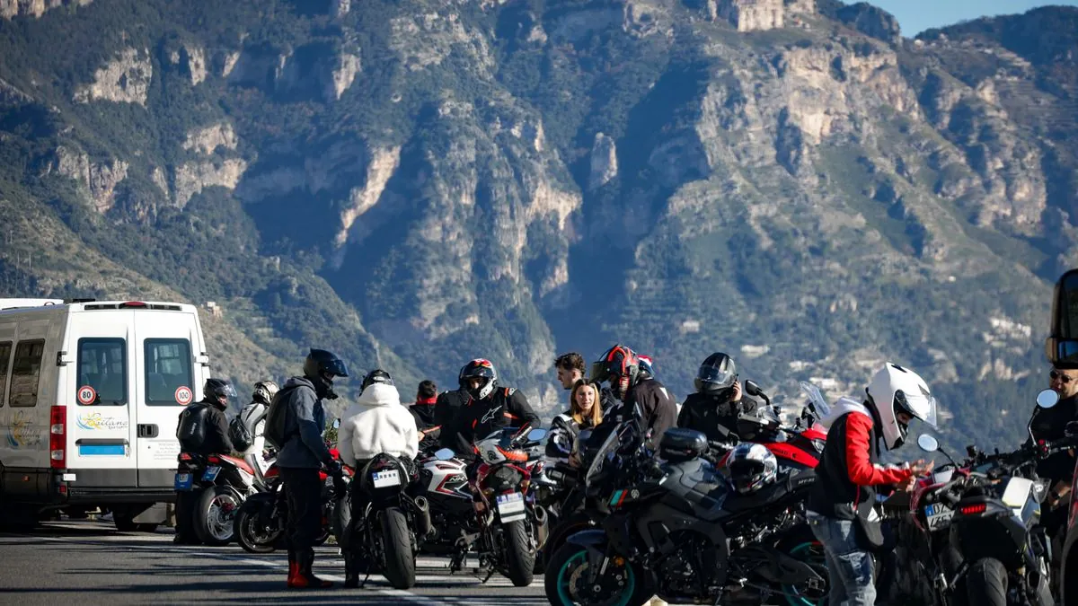 Group of motorcyclists riding together on a scenic mountain road in Cape Breton