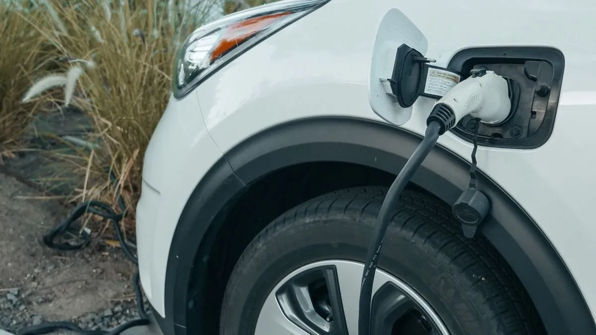 Electric vehicle charging at a station