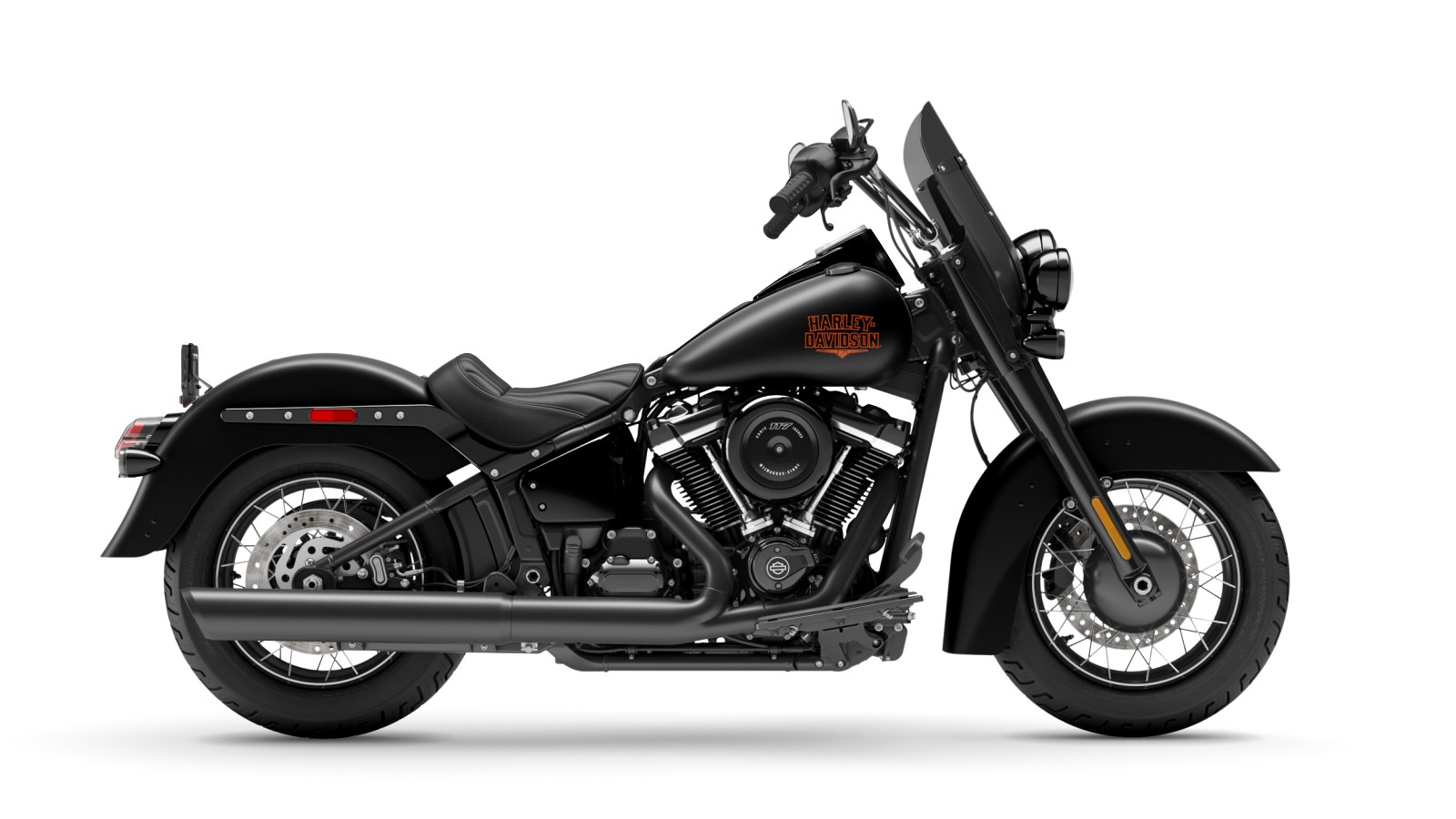 2026 Harley-Davidson Deadwood Softail cruiser in Denim Black paint being ridden on the open road