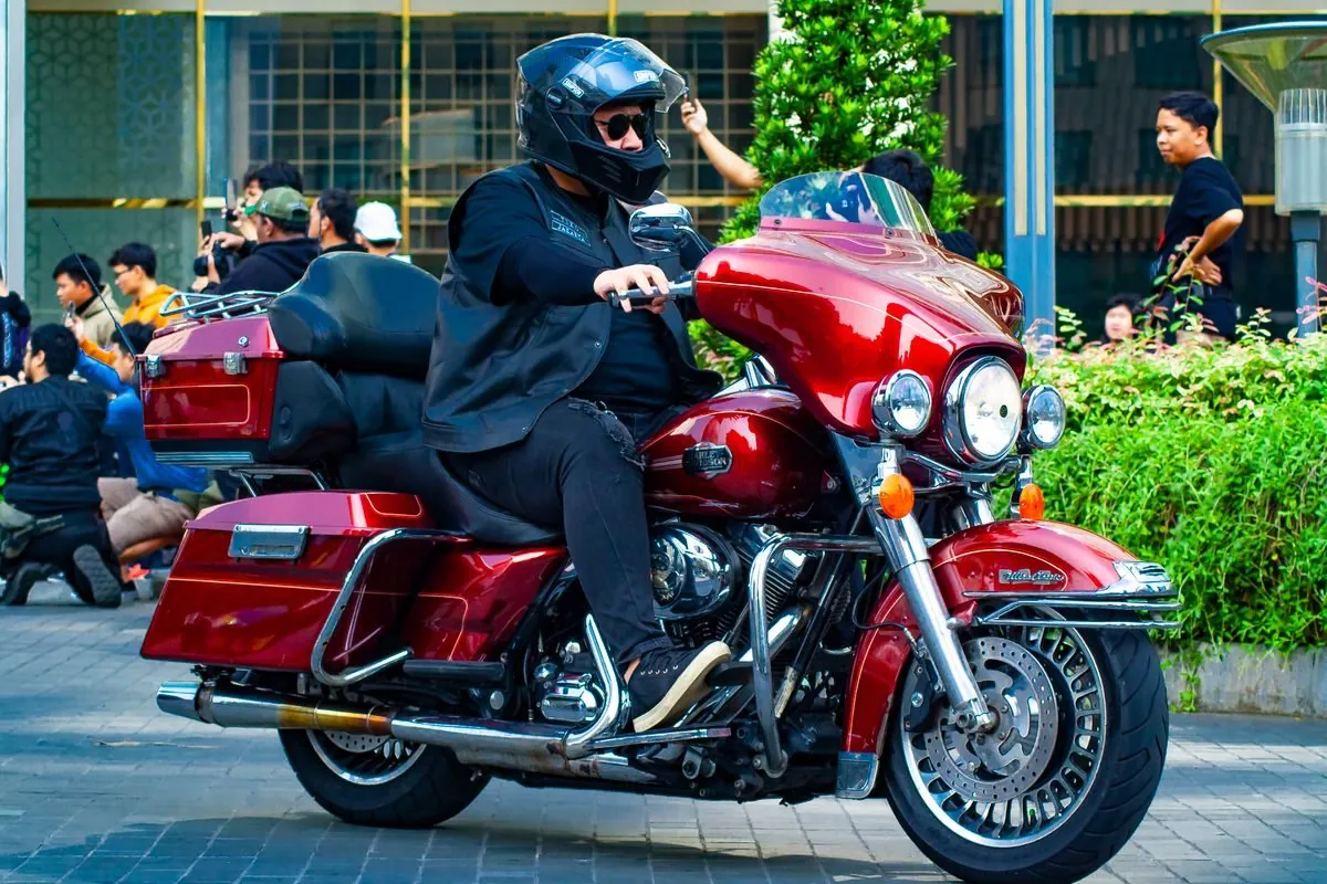 Rider on a Harley Davidson touring motorcycle in city traffic