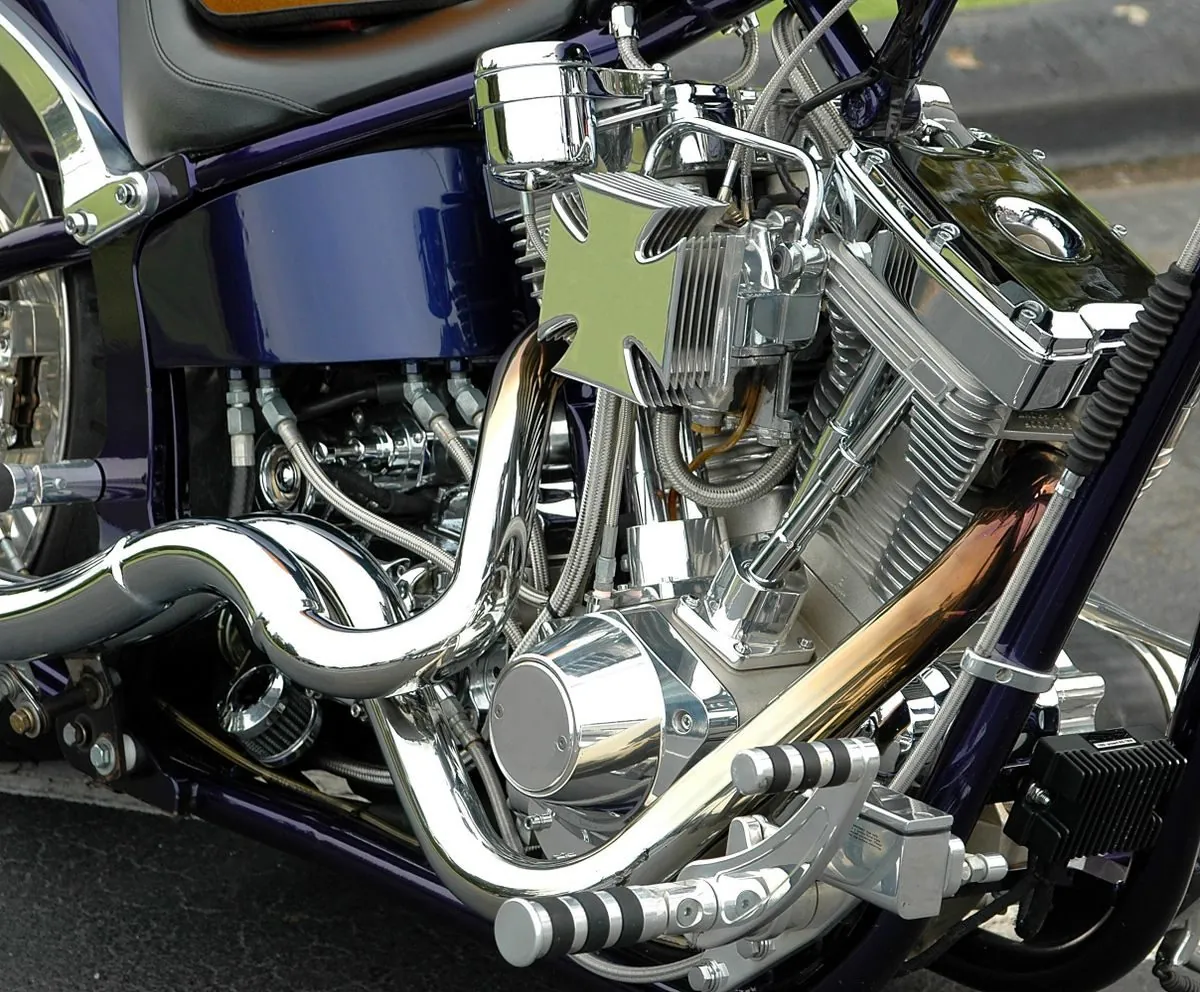 Close-up of polished chrome motorcycle engine and exhaust