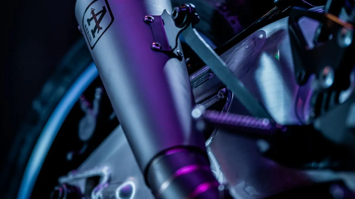Chrome motorcycle exhaust system close-up representing the Dr. Jekill & Mr. Hyde electronically adjustable exhaust for Indian Pursuit