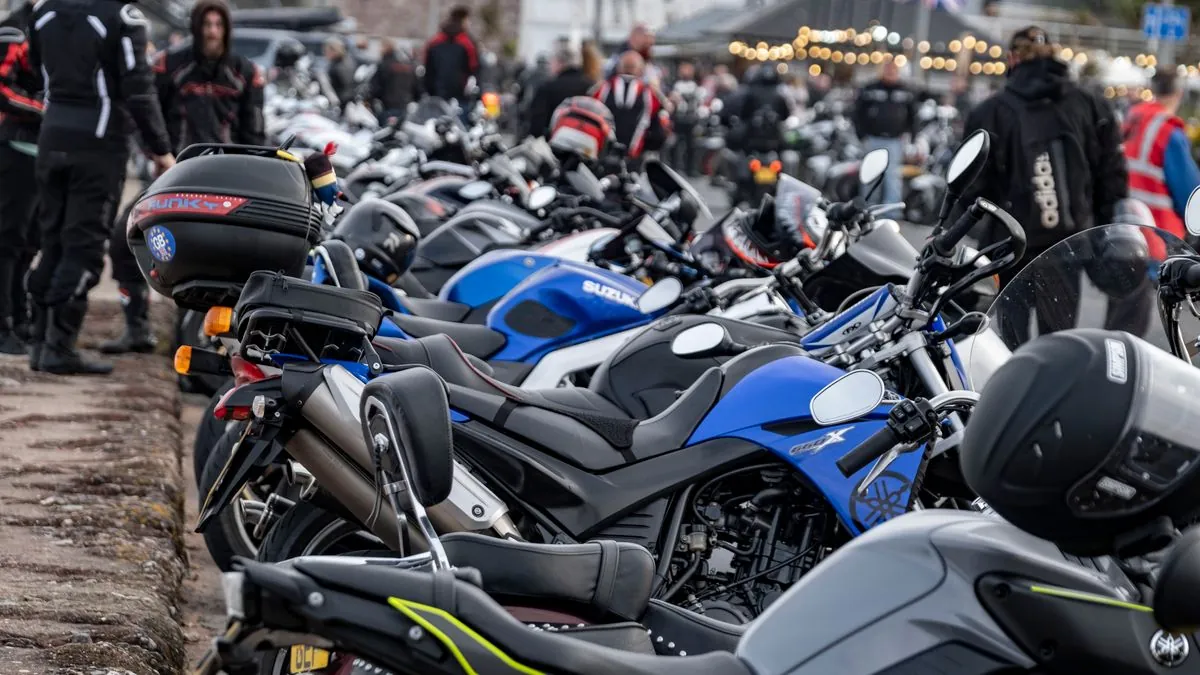 Motorcycle rally crowd at Sturgis with rows of parked bikes