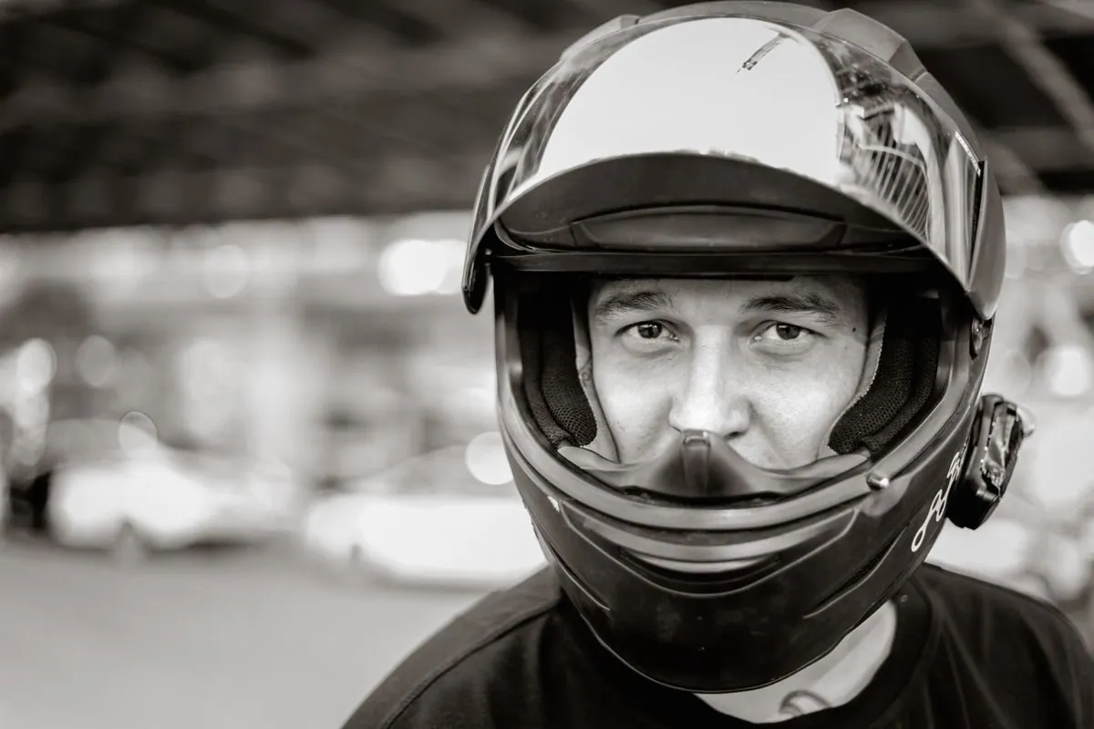 Close-up of a motorcyclist wearing a helmet