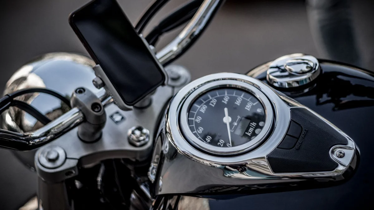 Seven essential gadgets arranged for a motorcycle touring trip