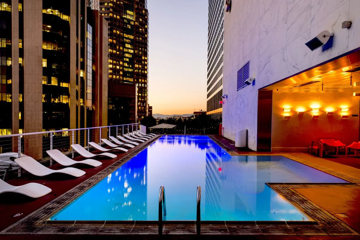 Clean backyard swimming pool ready for robotic pool cleaner testing