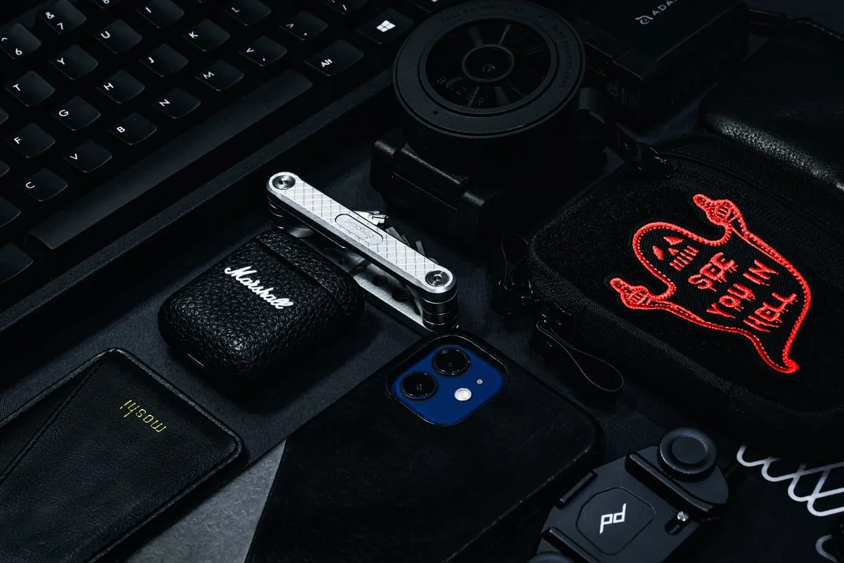 Flat lay of modern electronics including camera, smartphone and keyboard — tech gifts for Father's Day
